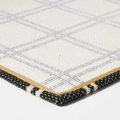 1'6"x2'6" Indoor/Outdoor Plaid Scatter Halloween Doormat Black/White - Hyde & EEK! Boutique™ -Home Textiles Store GUEST 61fba789 c646 4b6a 8307 45e32a6f8042